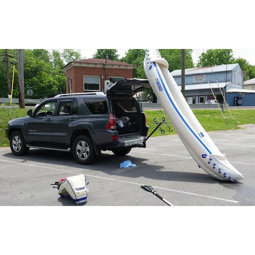 Sea Eagle 330 Sport Inflatable Kayak leaned up against the trunk of an SUV.