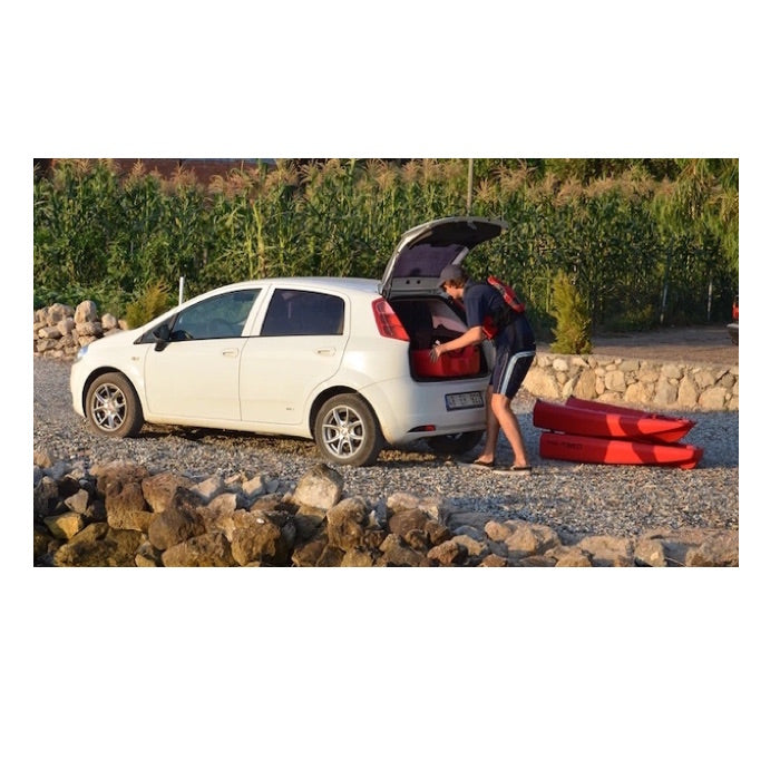 Falcon Tandem Kayak being unloaded from the back of the car.