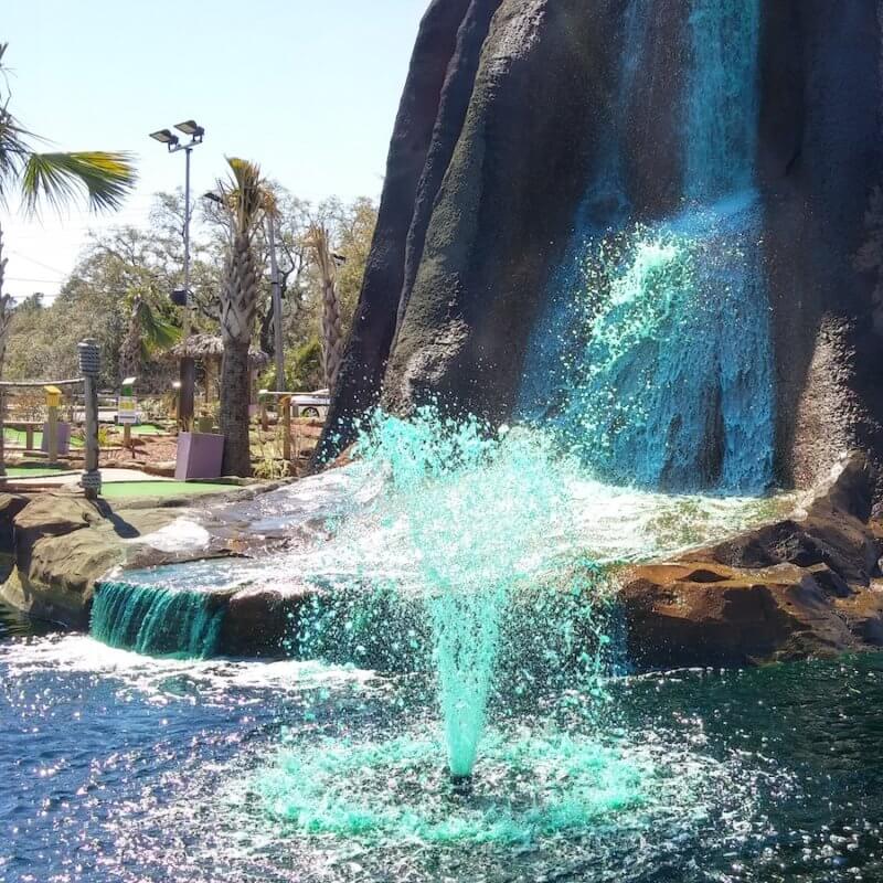 Horizontal Fixed Base Olympus Fountain in the middle of a lake